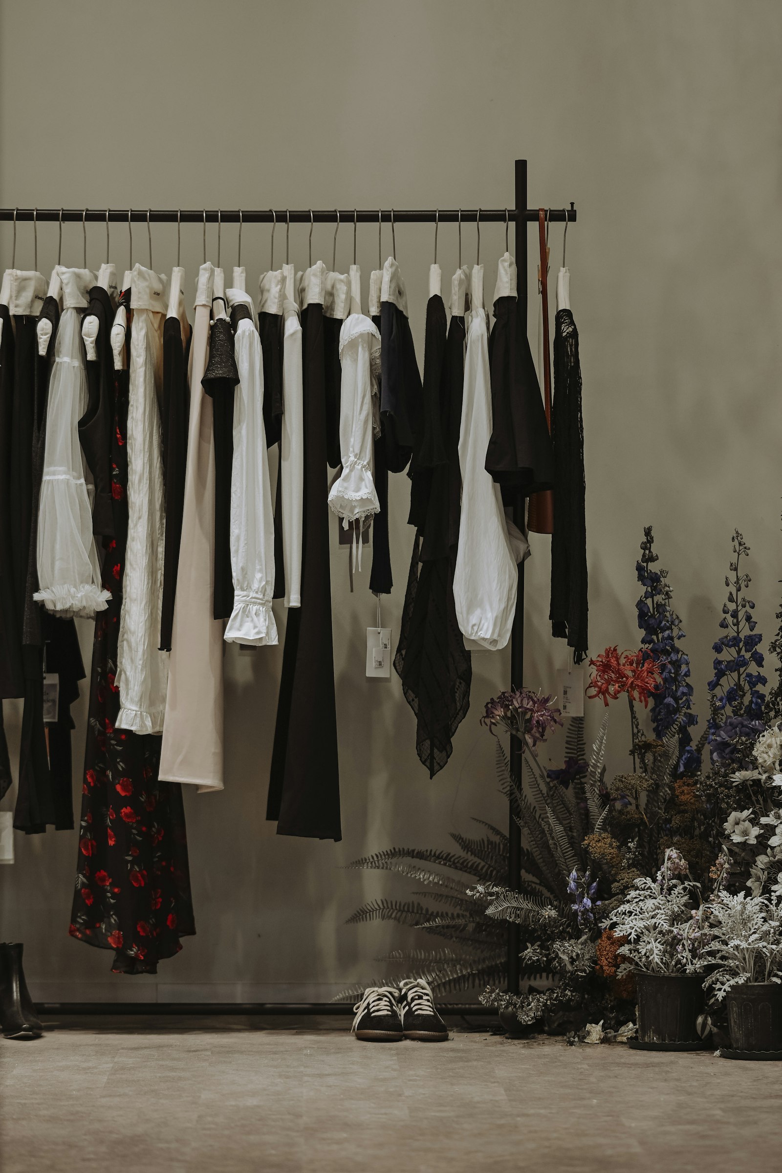 Dresses hanging on a rack in a boutique